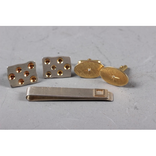 361 - A pair of 14ct gold and diamond cufflinks, 11.1g, a pair of silver cufflinks and a silver tie clip