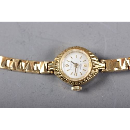 382 - A lady's rolled gold Regency manual wind bracelet watch with silvered dial and Arabic and baton nume... 