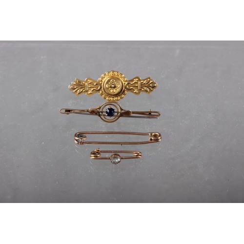 385 - A 9ct gold mourning brooch, a similar brooch set with blue stone and two other brooches, 5.2g gross