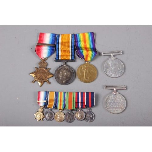 410 - A WWI medal group, two WWII medals and a miniature medal group