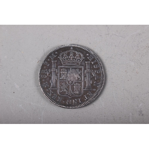 411 - A Spanish Carolus IIII silver dollar with oval countermark