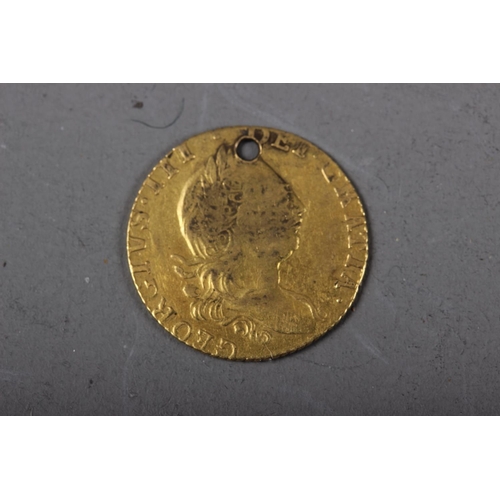 414 - A George III half guinea, dated 1775 (drilled)