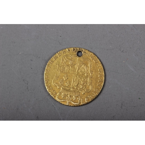 414 - A George III half guinea, dated 1775 (drilled)