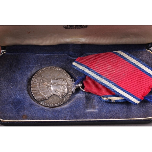 424 - A George V and Queen Mary Silver Jubilee medal, in associated medal box