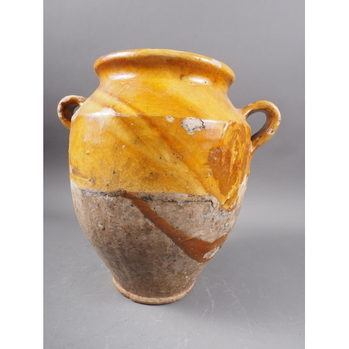 93 - An 18th century honey glazed two-handled urn, 10 1/2