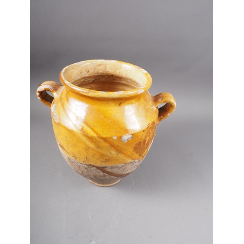 93 - An 18th century honey glazed two-handled urn, 10 1/2