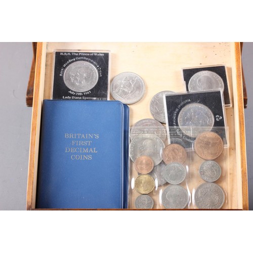 421 - A collector's coin chest, containing a selection of British and world coins