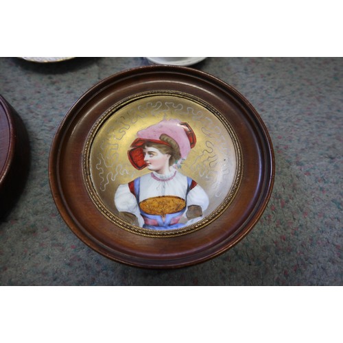 8 - A pair of 19th century French porcelain wall plates, women in period costume, 4