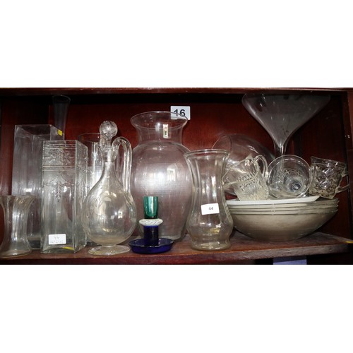 44 - A quantity of mostly clear glass vases, jugs and bowls, including a jug and stopper with etched deco... 