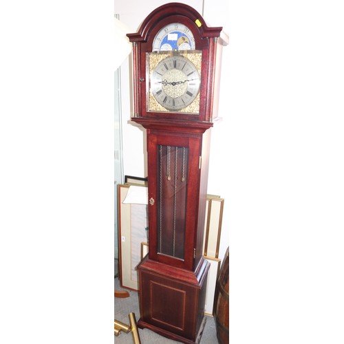 600 - A modern mahogany long case clock with brass arch top dial and eight-day striking and chiming moveme... 