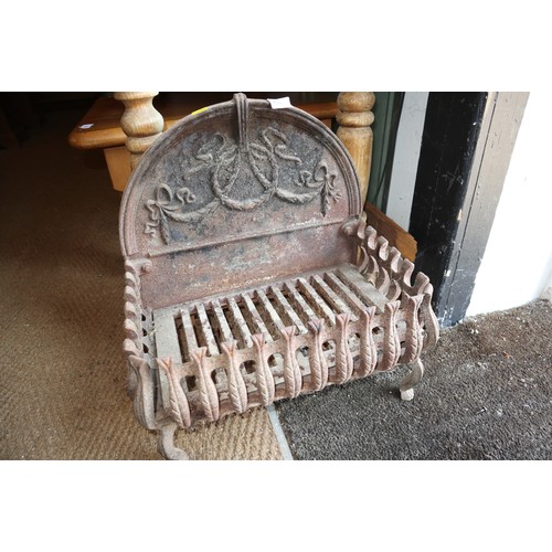 732 - A cast iron fire basket with demi-lune swag decorated back, 17