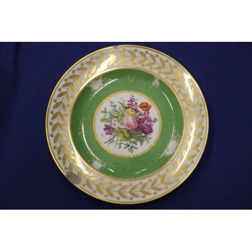 56 - Fourteen Sevres dessert plates with central floral decoration and green and gilt borders, 9 1/4