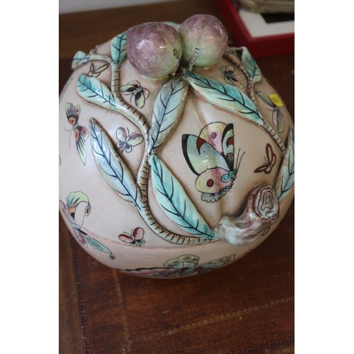 99 - A Chinese tureen and cover, formed as a peach with peach finials and insect polychrome decoration, 9... 