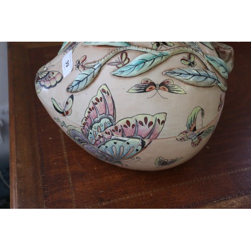 99 - A Chinese tureen and cover, formed as a peach with peach finials and insect polychrome decoration, 9... 