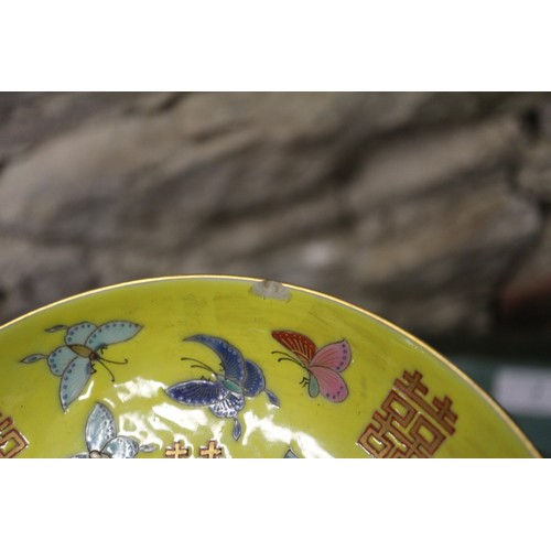 104 - A Chinese dish decorated character and butterflies and reverse decorated with flowers, four-characte... 