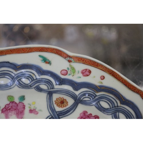 126 - Four Chinese famille rose shaped edge plates with floral spray and blue twisted decoration, 9