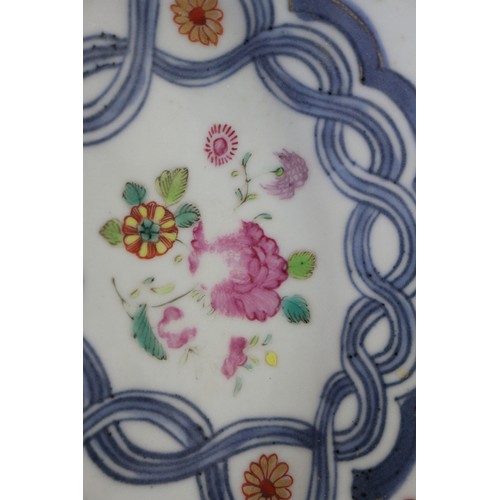 126 - Four Chinese famille rose shaped edge plates with floral spray and blue twisted decoration, 9