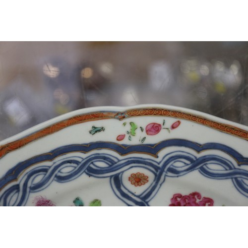 126 - Four Chinese famille rose shaped edge plates with floral spray and blue twisted decoration, 9