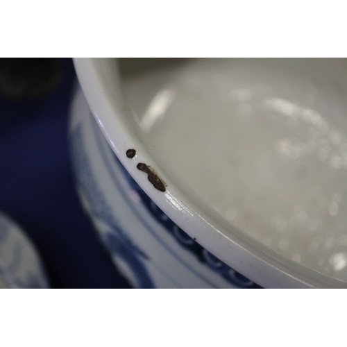 109 - A Chinese blue and white jardiniere with panelled precious object decoration, 8 3/4