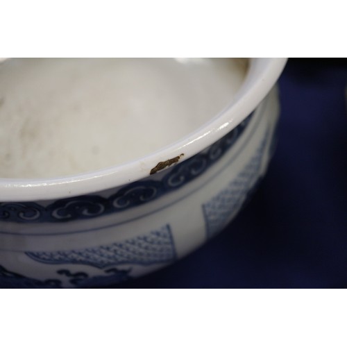 109 - A Chinese blue and white jardiniere with panelled precious object decoration, 8 3/4