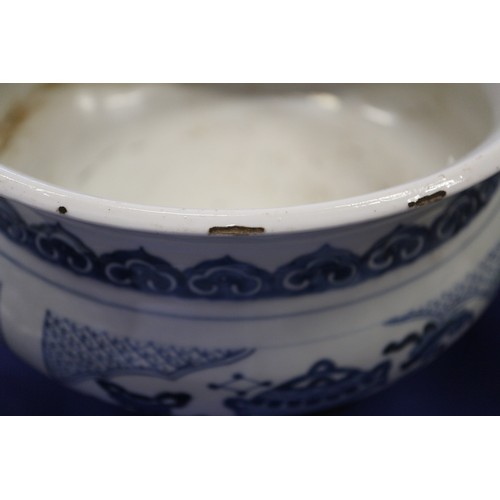 109 - A Chinese blue and white jardiniere with panelled precious object decoration, 8 3/4