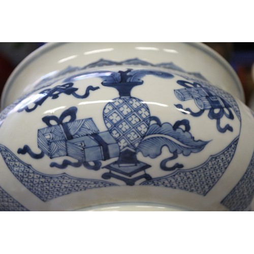 109 - A Chinese blue and white jardiniere with panelled precious object decoration, 8 3/4