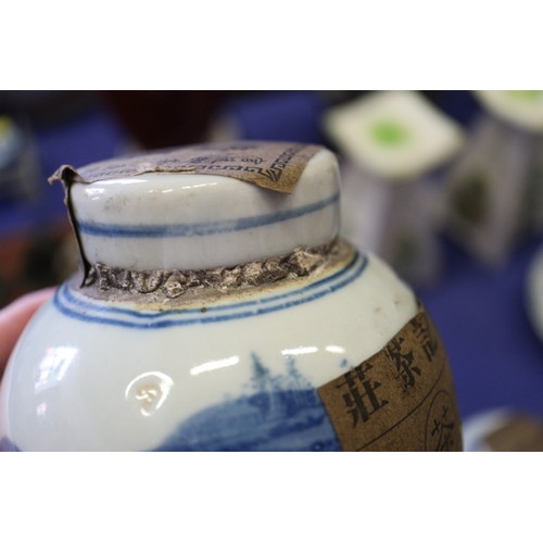 109 - A Chinese blue and white jardiniere with panelled precious object decoration, 8 3/4