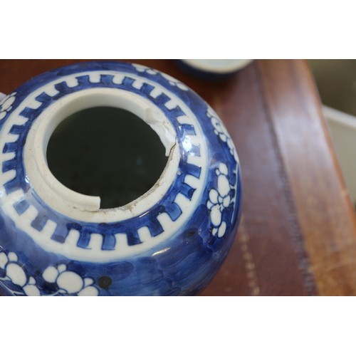 120 - Three Chinese blue and white ginger jars and covers with prunus decoration and double ring marks to ... 