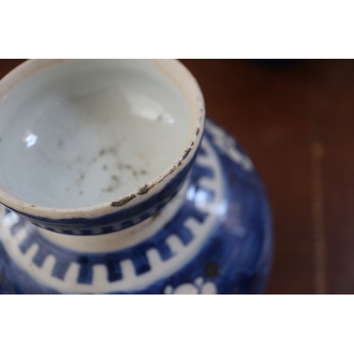 120 - Three Chinese blue and white ginger jars and covers with prunus decoration and double ring marks to ... 