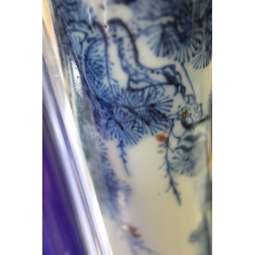 108 - A Chinese blue, white and iron oxide bulbous bottle neck vase with figures in a landscape decoration... 