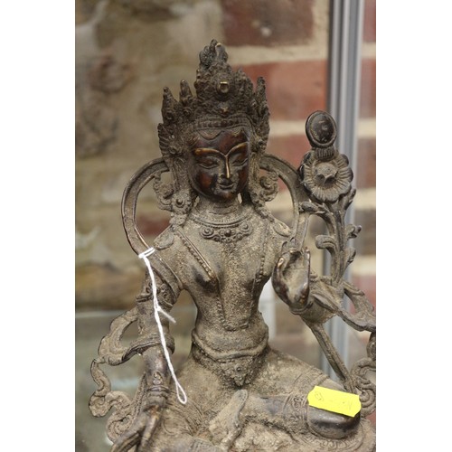 136 - A Chinese metal figure of a deity, 9