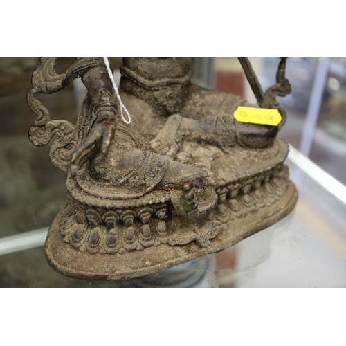 136 - A Chinese metal figure of a deity, 9