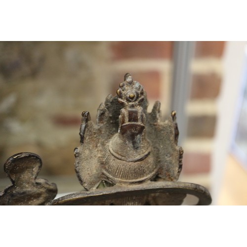 136 - A Chinese metal figure of a deity, 9