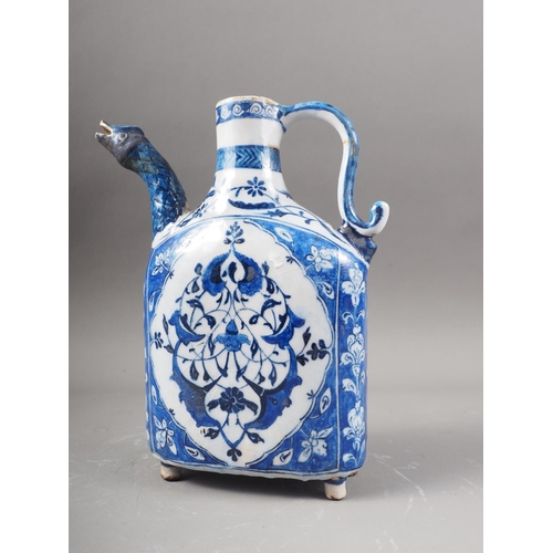 7 - An Iznik blue and white decorated jug with animal head spout, 9 1/2