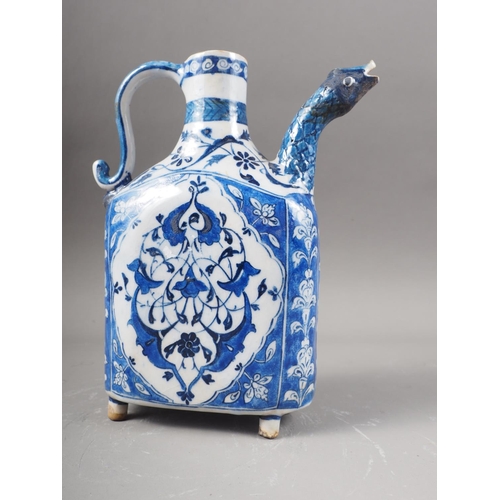 7 - An Iznik blue and white decorated jug with animal head spout, 9 1/2