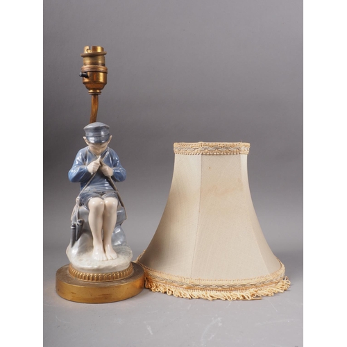 12 - A Royal Copenhagen figure, boy cutting a stick (905), mounted as a table lamp