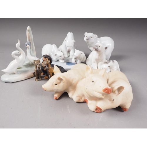 37 - A Lladro polar bear group (01443), a smaller polar bear group, a solo polar bear, a group of three p... 