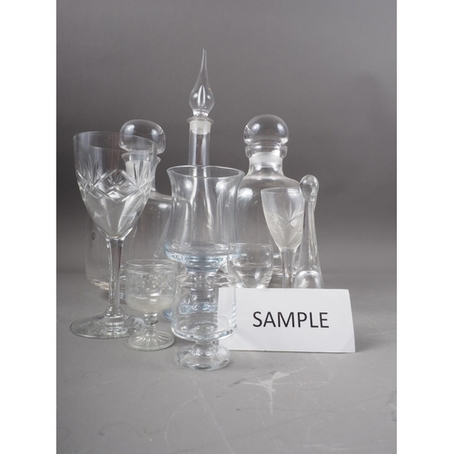 39 - A Dartington decanter, another similar, four other decanters, a Slovenian crystal glass vase, 9 1/4