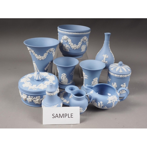 42 - A quantity of Wedgwood light blue jasperware, including a flared rim vase, 6