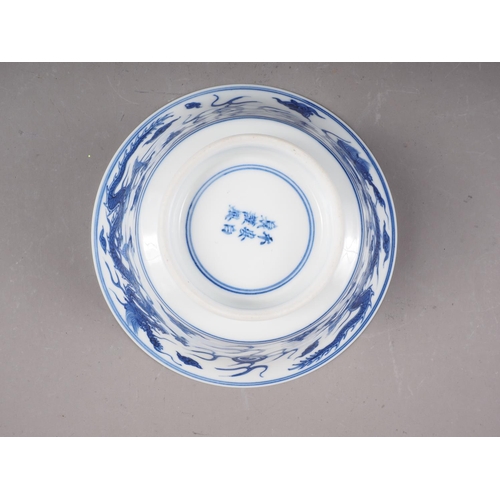 69 - *A Chinese blue and white bowl with exterior dragon, cloud and flaming pearl decoration, and interio... 