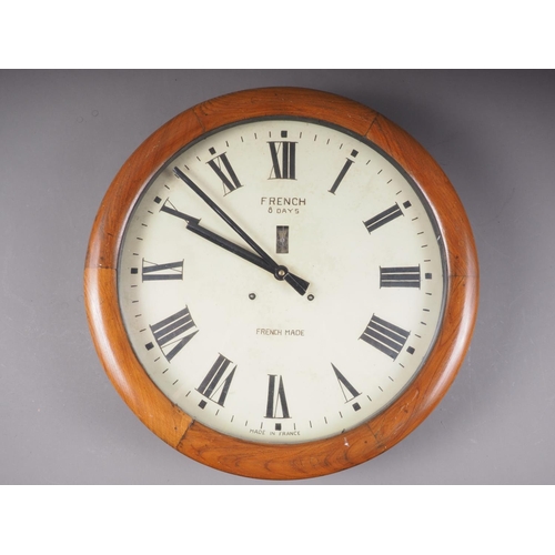 102 - A French eight-day oak cased wall clock with painted dial and Roman numerals, 20 1/2