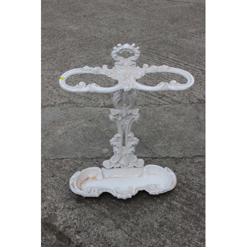 109 - A white painted cast iron scrollwork umbrella stand, 18