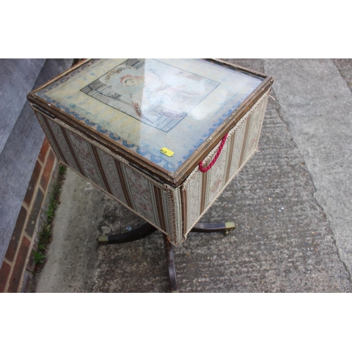 522 - A 19th century work table/box with petit point panel top, on turned painted column and quadruple spl... 