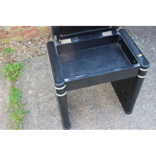 596 - A 1930s black lacquered and chrome mounted box seat piano stool, 20