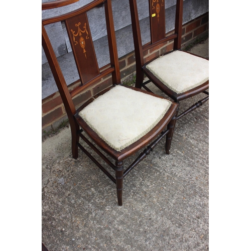 604 - A set of three Edwardian mahogany and inlaid salon chairs, on turned and stretchered supports (2+1),... 