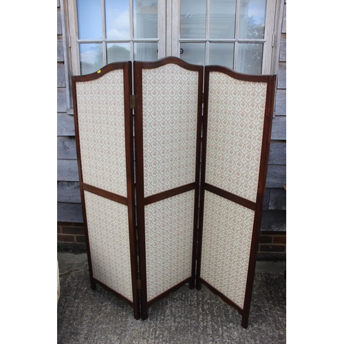 613 - A mahogany three-fold shape top screen, panels 18