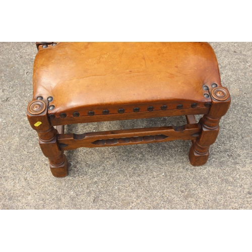 618 - A walnut frame stool with leather top, on turned and stretchered supports, 22