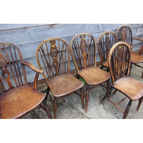 609 - A set of six late 19th century Windsor wheelback chairs with elm panel seats, on turned and stretche... 