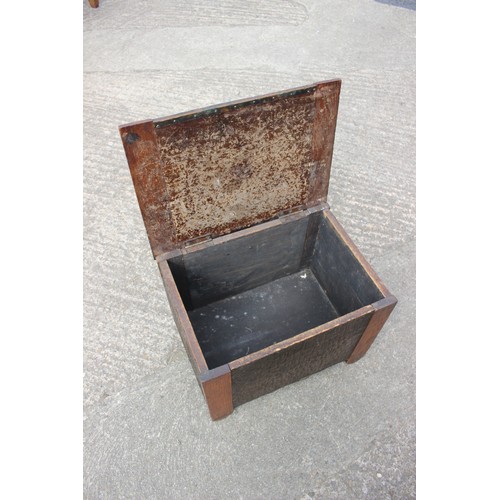 645 - An oak and embossed copper log bin, 17 1/2