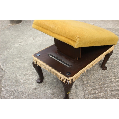 638 - A carved walnut stool, on cabriole supports, 19